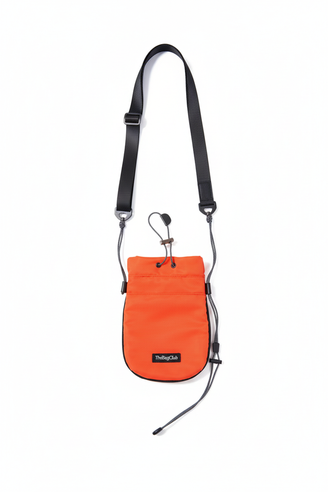 Full view of orange crossbody bag