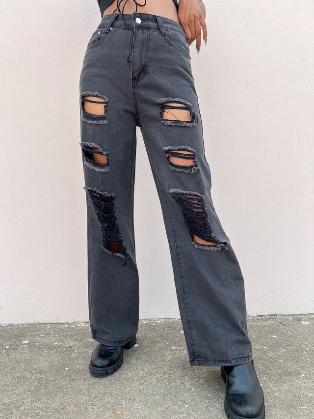ASYMETRICAL RIPPED JEANS
